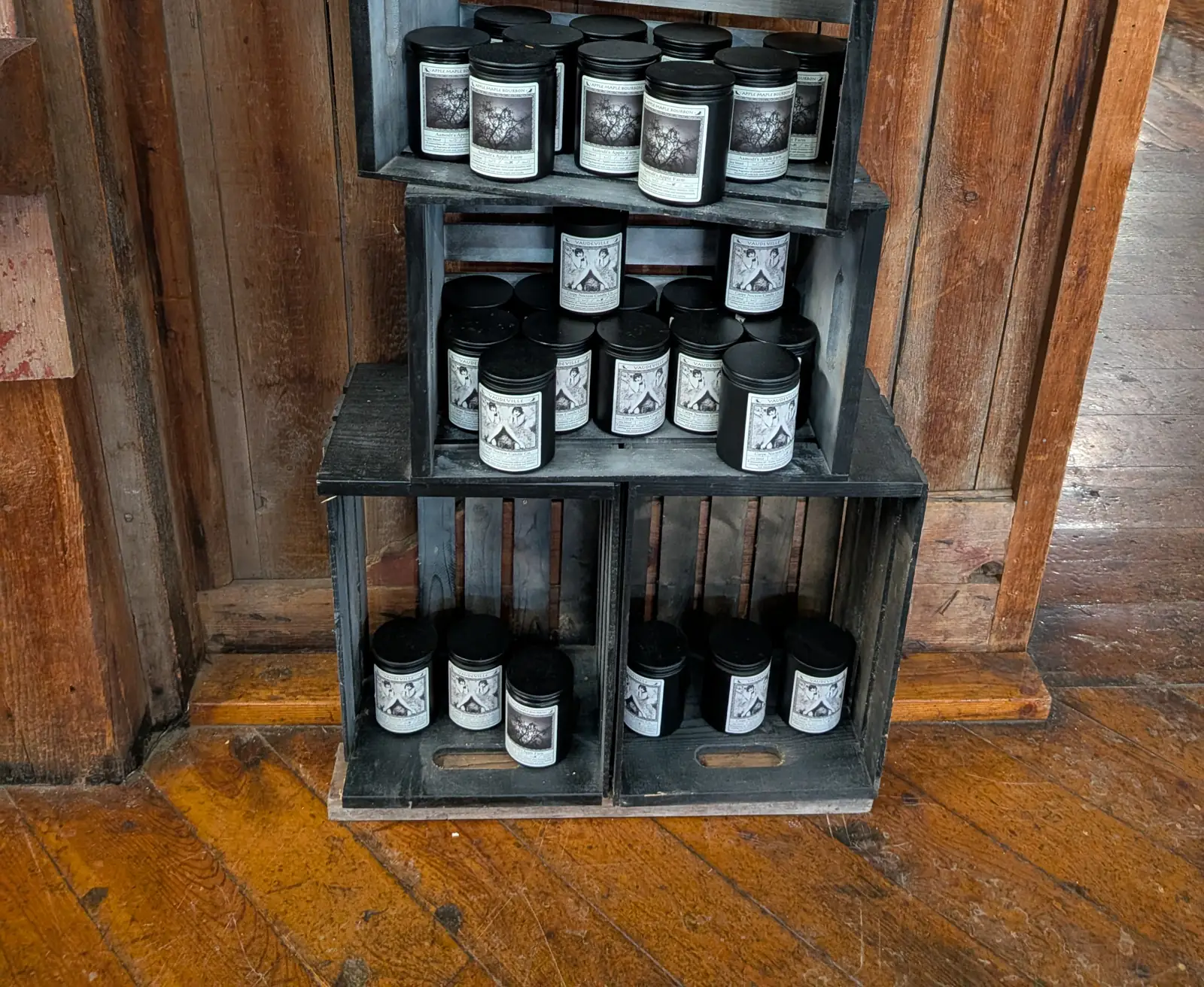 Hand-poured candles stacked in apple crates in the Apple Barn