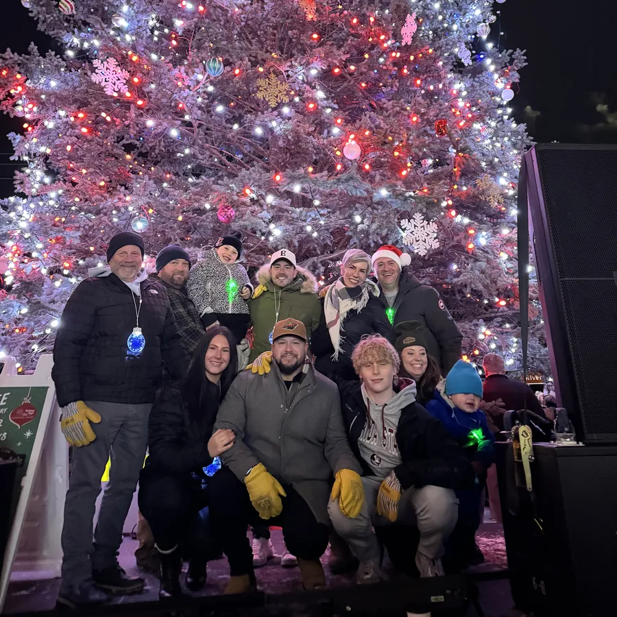 The Aamodt family with Stillwater Mayor Ted Kozlowski at the 2025 Stillwater Christmas tree lighting